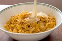 Cornflakes with milk pouring in.jpg